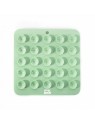 tapis de léchage pour chat vert silicone trio martin sellier de dos avec des ventouses