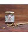 Booster de repas pour chien crumble de poulet Cooka's Cookies dans une cuillère avec le pot disposé à côté